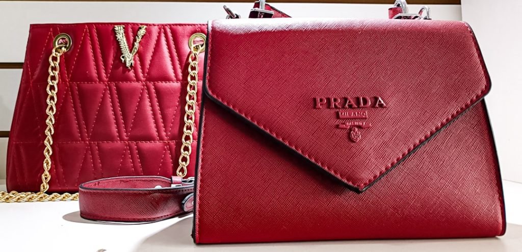 a-red-purse-sitting-next-to-a-red-cup-eaumt81hwxe